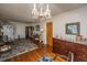 Formal living room featuring hardwood floors, decorative chandelier, and traditional furnishings at 5302 Helene Dr, North Charleston, SC 29418
