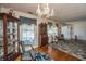 Formal living room featuring hardwood floors, decorative chandelier, and ample natural light at 5302 Helene Dr, North Charleston, SC 29418