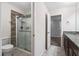 Bathroom showcasing a glass shower with tiled walls and a dark wood vanity at 536 Man O War Ln, Moncks Corner, SC 29461