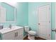Bathroom with a bright accent wall, white vanity, and modern sink and toilet at 536 Man O War Ln, Moncks Corner, SC 29461