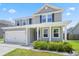 Charming two-story home with a covered front porch and manicured lawn at 536 Man O War Ln, Moncks Corner, SC 29461