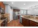 Spacious kitchen with stainless steel appliances, granite countertops and an island with a breakfast bar at 536 Man O War Ln, Moncks Corner, SC 29461