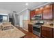 Granite countertops complement the stainless steel appliances in the spacious kitchen; convenient and stylish at 536 Man O War Ln, Moncks Corner, SC 29461