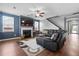 Spacious living room with modern fireplace, plush seating, and ample natural light, perfect for gatherings at 536 Man O War Ln, Moncks Corner, SC 29461
