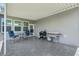 Covered patio features blue chairs, a table and grilling equipment at 536 Man O War Ln, Moncks Corner, SC 29461