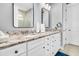 Bathroom vanity features double sinks, granite counters, sleek rectangular mirrors, and bright lighting at 554 Tidewater Chase Ln, Summerville, SC 29486