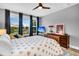 Bright bedroom with large windows, wooden furniture, and area rug at 554 Tidewater Chase Ln, Summerville, SC 29486