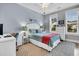 Bedroom featuring a ceiling fan, three windows, blue bedding, and a gray rug at 554 Tidewater Chase Ln, Summerville, SC 29486