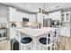 Spacious kitchen featuring a large island with seating, modern appliances, and stylish fixtures for cooking and entertaining at 554 Tidewater Chase Ln, Summerville, SC 29486