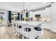 Stylish kitchen featuring a large island with bar stool seating, stainless appliances, and hardwood floors at 554 Tidewater Chase Ln, Summerville, SC 29486