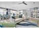 Open-concept living area with kitchen and dining area, ceiling fan, and comfortable seating at 554 Tidewater Chase Ln, Summerville, SC 29486