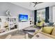Comfortable living room with ample natural light, ceiling fan, and modern furnishings at 554 Tidewater Chase Ln, Summerville, SC 29486
