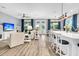 Expansive living space featuring a large island with barstool seating and lots of natural light at 554 Tidewater Chase Ln, Summerville, SC 29486