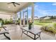 Comfortable screened-in porch with ceiling fan, perfect for entertaining and enjoying the outdoors at 554 Tidewater Chase Ln, Summerville, SC 29486