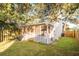 Grassy backyard with screen porch, privacy fence, and shade trees, ideal for outdoor enjoyment at 623 Bay Tree Ct, Mount Pleasant, SC 29464