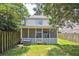 Spacious backyard featuring a fenced-in lawn and a screened-in porch at 623 Bay Tree Ct, Mount Pleasant, SC 29464