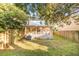 Backyard with screen porch, privacy fence, green lawn, and an AC unit at 623 Bay Tree Ct, Mount Pleasant, SC 29464