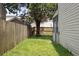 Fenced backyard offers privacy and green space, complemented by mature trees and a bright lawn at 623 Bay Tree Ct, Mount Pleasant, SC 29464