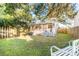 Lush backyard featuring a screened porch, green lawn, and a white bench, perfect for relaxation at 623 Bay Tree Ct, Mount Pleasant, SC 29464