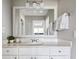 This charming bathroom offers a large mirror, bright lighting, and a white vanity with drawers at 623 Bay Tree Ct, Mount Pleasant, SC 29464