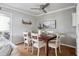 Cozy dining area with wood table and seating for six, adjacent to the living room and kitchen at 623 Bay Tree Ct, Mount Pleasant, SC 29464