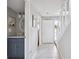 Bright entryway featuring tile flooring, staircase, and a glimpse of the adjacent powder room with vanity at 623 Bay Tree Ct, Mount Pleasant, SC 29464