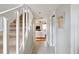 Hallway with stairwell leading to the upper level and a glimpse into the living room at 623 Bay Tree Ct, Mount Pleasant, SC 29464
