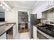 Efficient kitchen with stainless steel appliances and a view into the dining area at 623 Bay Tree Ct, Mount Pleasant, SC 29464