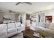 Open-concept living area with dining space, sofa, and rustic wooden coffee table at 623 Bay Tree Ct, Mount Pleasant, SC 29464