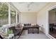 Spacious screened porch with comfortable seating and dining area for outdoor entertainment and relaxation at 623 Bay Tree Ct, Mount Pleasant, SC 29464