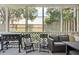 Screened porch with outdoor seating, a grill, and a view of the backyard enhancing outdoor living at 623 Bay Tree Ct, Mount Pleasant, SC 29464