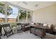 Relaxing screened porch with comfortable seating and an outdoor dining setup at 623 Bay Tree Ct, Mount Pleasant, SC 29464