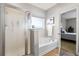 Bathroom featuring a jacuzzi tub and a separate shower with glass doors, offering a spa-like retreat at 644 Grassy Hill Rd, Summerville, SC 29483