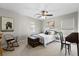 Bright bedroom with a wooden rocking chair, vintage chest, and dark wood desk at 644 Grassy Hill Rd, Summerville, SC 29483