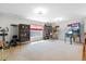 Expansive bonus room with windows, bookcase and pinball machine ideal for a home theater or play area at 644 Grassy Hill Rd, Summerville, SC 29483