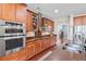 Well-equipped kitchen with stainless steel appliances, custom cabinets, and granite countertops for gourmet cooking at 644 Grassy Hill Rd, Summerville, SC 29483