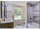 Modern bathroom with double vanity, soaking tub, and tiled shower offers a spa-like experience at 670 Dupre Rd, McClellanville, SC 29458