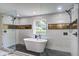 Updated bathroom featuring a soaking tub and large glass-enclosed shower at 670 Dupre Rd, McClellanville, SC 29458