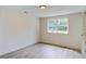 Bright bedroom with large window and stylish flooring offers a relaxing retreat at 670 Dupre Rd, McClellanville, SC 29458