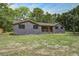 Inviting front exterior showcasing modern curb appeal, a well-maintained lawn, and tasteful landscaping at 670 Dupre Rd, McClellanville, SC 29458