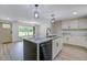 Open-concept kitchen with a large island and stainless steel dishwasher at 670 Dupre Rd, McClellanville, SC 29458