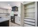 Kitchen features modern appliances and custom-built storage cabinets at 670 Dupre Rd, McClellanville, SC 29458
