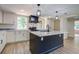 Bright, modern kitchen boasts a large island and stainless steel appliances at 670 Dupre Rd, McClellanville, SC 29458