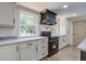 Bright kitchen with stainless steel oven and ample counter space at 670 Dupre Rd, McClellanville, SC 29458