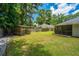 Lush backyard featuring a covered pergola and a screened porch, providing outdoor relaxation at 687 Ponderosa Dr, Charleston, SC 29414