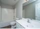 Bathroom featuring a tub with shower, and a white vanity and toilet at 687 Ponderosa Dr, Charleston, SC 29414