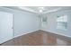 Bedroom with tray ceilings, crown molding, bright windows and door at 687 Ponderosa Dr, Charleston, SC 29414