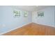 Bedroom featuring hardwood floors and natural light from three windows at 687 Ponderosa Dr, Charleston, SC 29414
