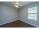 Bedroom with a ceiling fan, hardwood floors and natural light from a window at 687 Ponderosa Dr, Charleston, SC 29414
