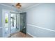 View of foyer with wooden floors and chandelier, leading to front porch at 687 Ponderosa Dr, Charleston, SC 29414